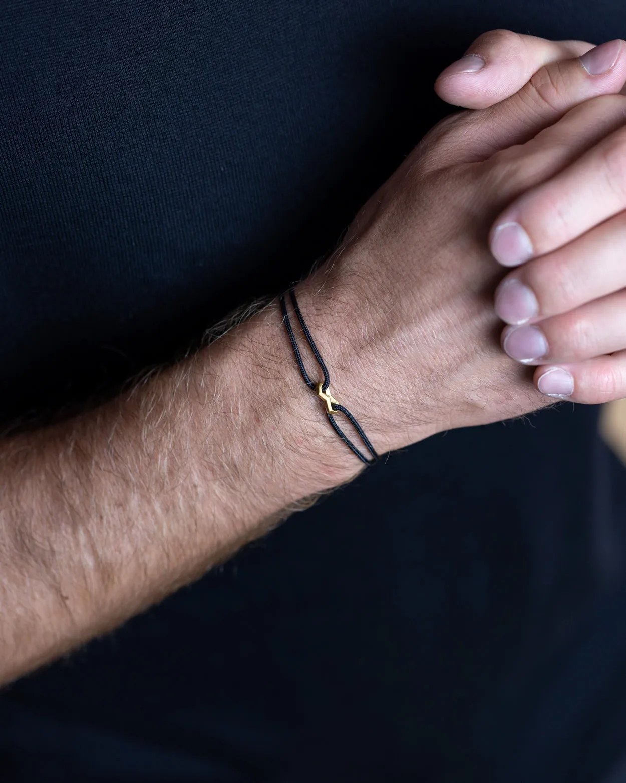 1.5mm Black nylon bracelet with a gold-plated Infinity sign