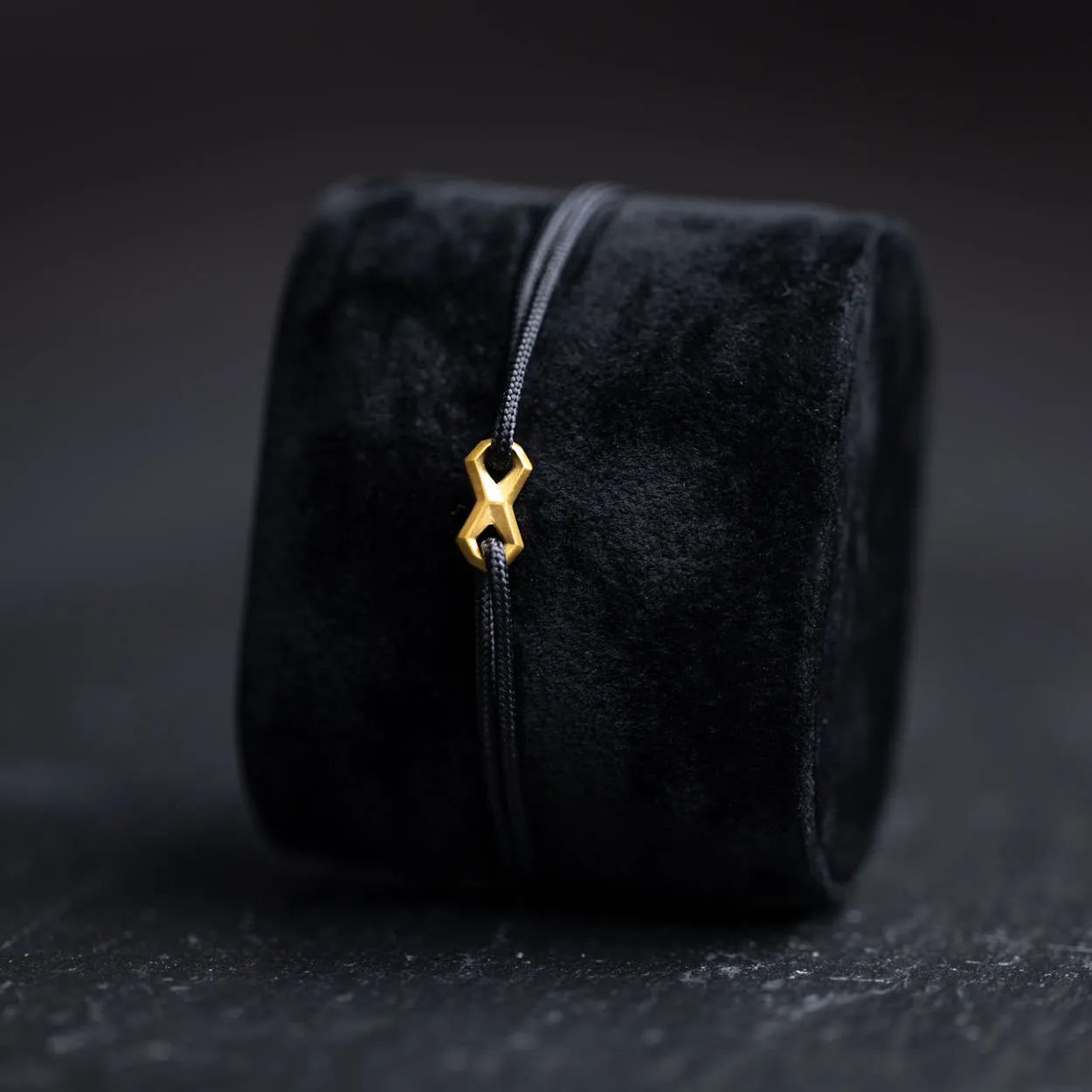 1.5mm Black nylon bracelet with a gold-plated Infinity sign